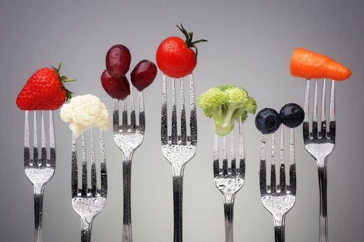 fruits and vegetables on forks