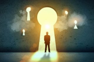 graphic of a man standing in large keyhole