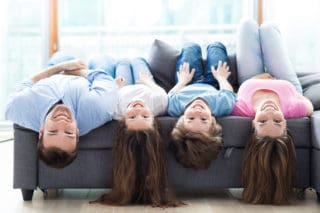 family hanging heads upside down