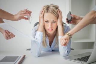 woman overwhelmed by things she has to do