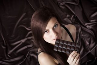 woman eating dark chocolate