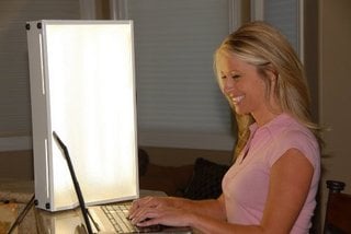 woman using a light therapy box