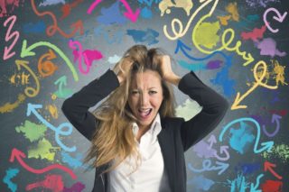 photo depicting an overwhelmed woman pulling her hair
