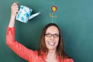 woman watering flower springing from her head
