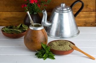 photo of yerba mate tea leaves, teapot, and gourd for drinking